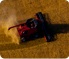 Aerial view of a tractor harvesting wheat