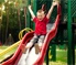 Little kids playing on the slide