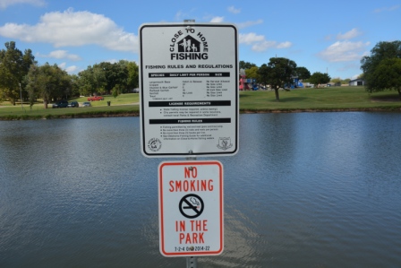 Meadowlake S fishing rules and no smoking sign